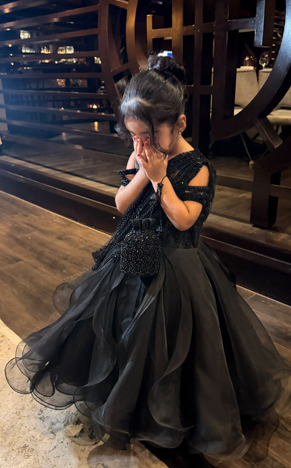 Celeste gown with a full layered organza skirt and beaded drape; styling pouch not included