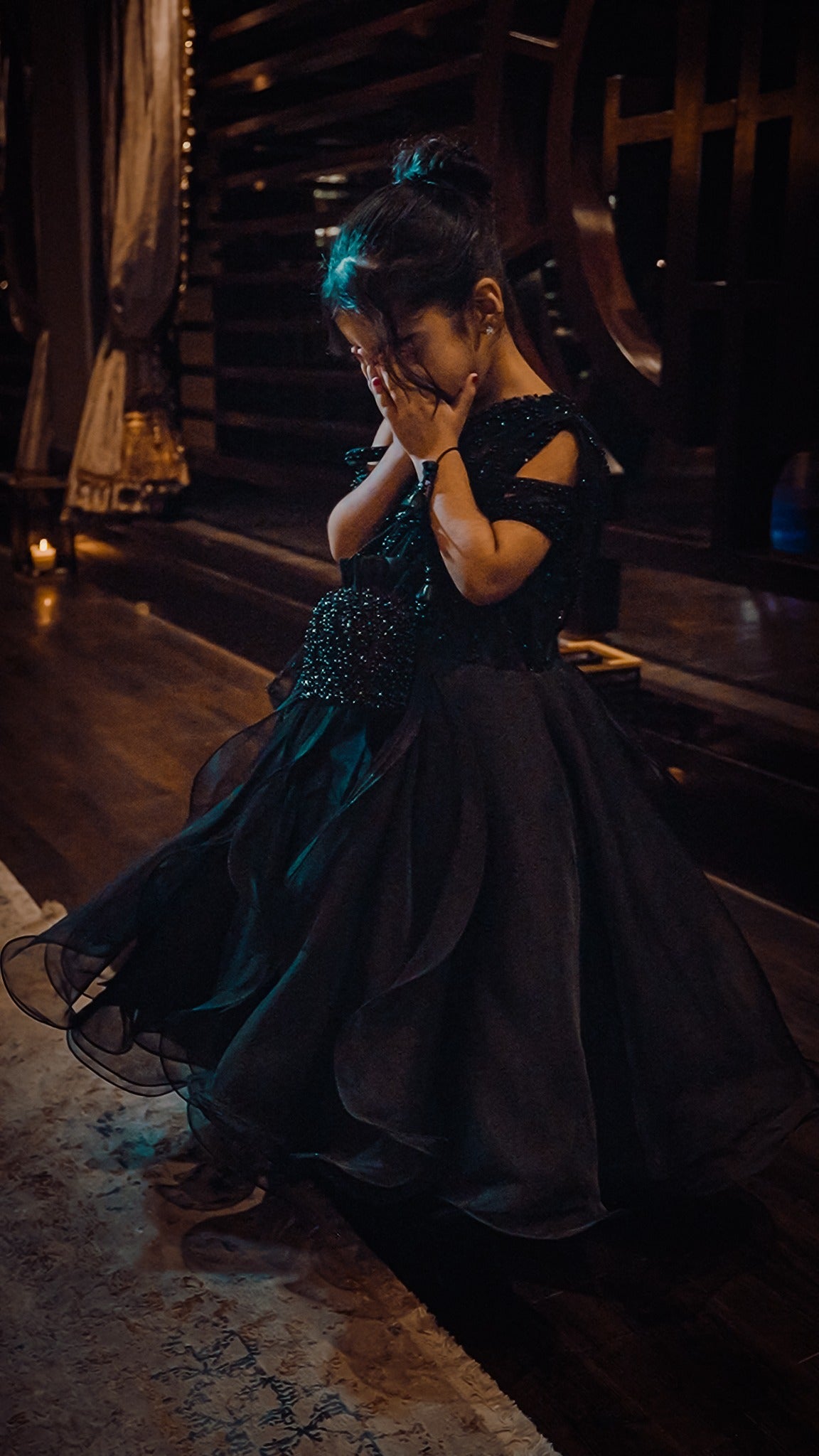 Celeste black occasion gown with beaded bodice and full ruffled organza skirt